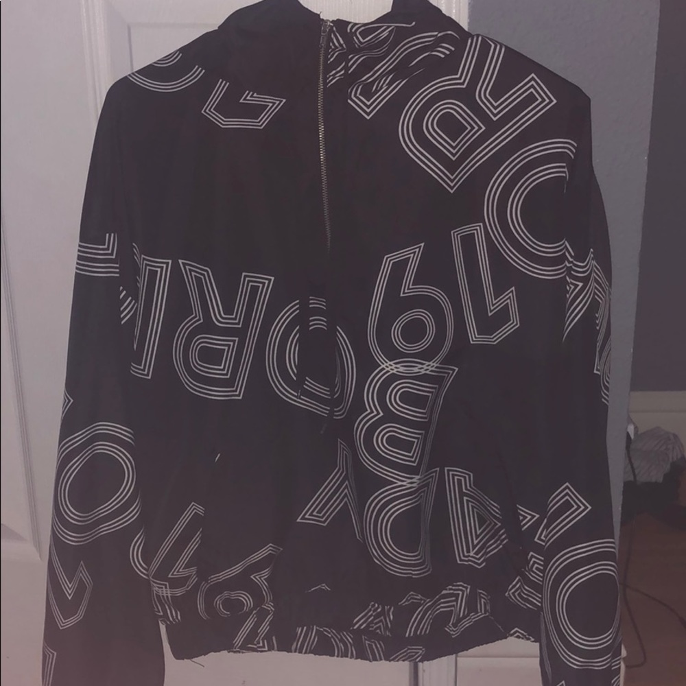Black and white lettered Wind Breaker